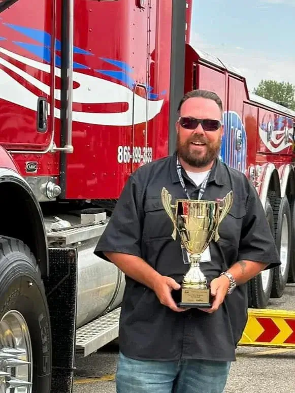 Owner holding a trophy